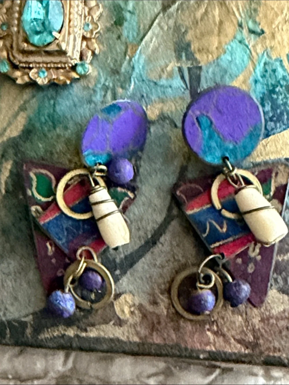 Clip style earrings artist made abstract metal pieces with attached panels